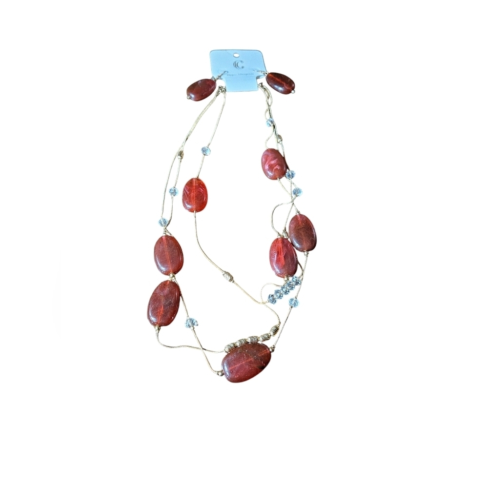 NWT multi stranded necklace with matching earrings.